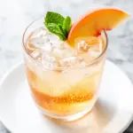 sparkling peach bourbon smash - featured image