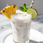 creamy coconut pina colada mocktail - featured image